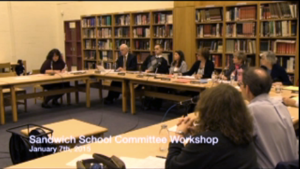 Michelle Austin explained the Summary of the Budget and the Salaries at each site. Photo from the SCT video. 